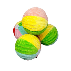 Rubber squeaky ball dog toy wrapped in fabric to look like a beach ball. 