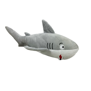 Plush dog toy designed to look like a shark.