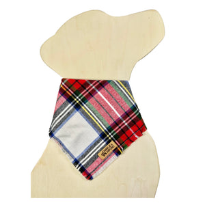 Plaid bandana on a wooden dog mannequin with a visible brand logo 'Charlie & the Hound'. Plaid features classic colors of red, green, blue, yellow, black and white.