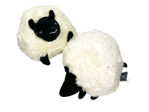 Two squeaky ball dog toys designed to look a like sheep on a white background. 