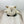 Owl-shaped dog toy made from natural and earth friendly materials. The toy is sitting on a light wooden surface with a white background. 