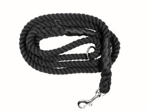 Black colored rope dog leash with rose gold hardware and charm coiled up a white background. 