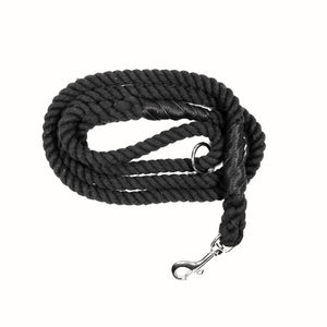 Black colored rope dog leash with rose gold hardware and charm coiled up a white background. 