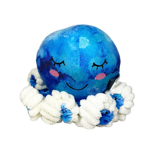 Plush blue tie-dyed octopus dog toy with white accents and a smiling face on a white background.