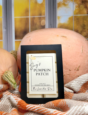 Wax melt snap bars in black box with pumpkins and plaid fabric in the background.