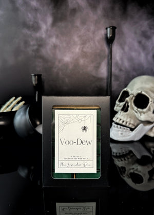 Voo-Dew wax melt snap bars in a black box on a black background with skull and cauldron accents
